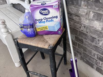 Swiffer Wet Mop plus 1 Bottle of Solution and a mostly full box of Pads