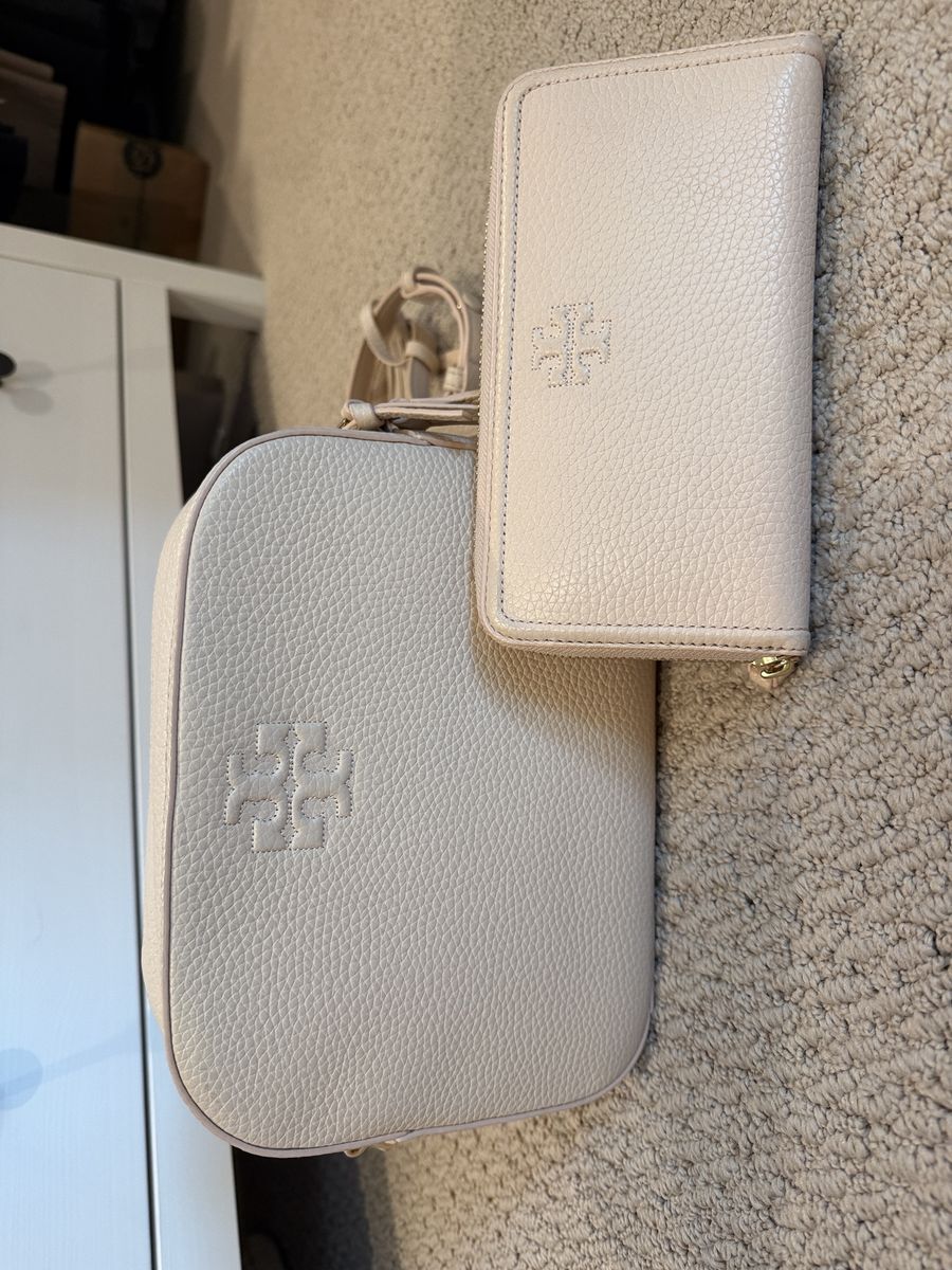 Tory Burch pink cream pebbled leather crossbody purse with matching wallet.