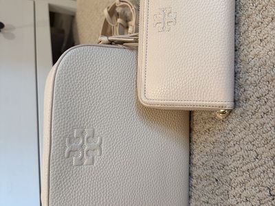 Tory Burch pink cream pebbled leather crossbody purse with matching wallet.