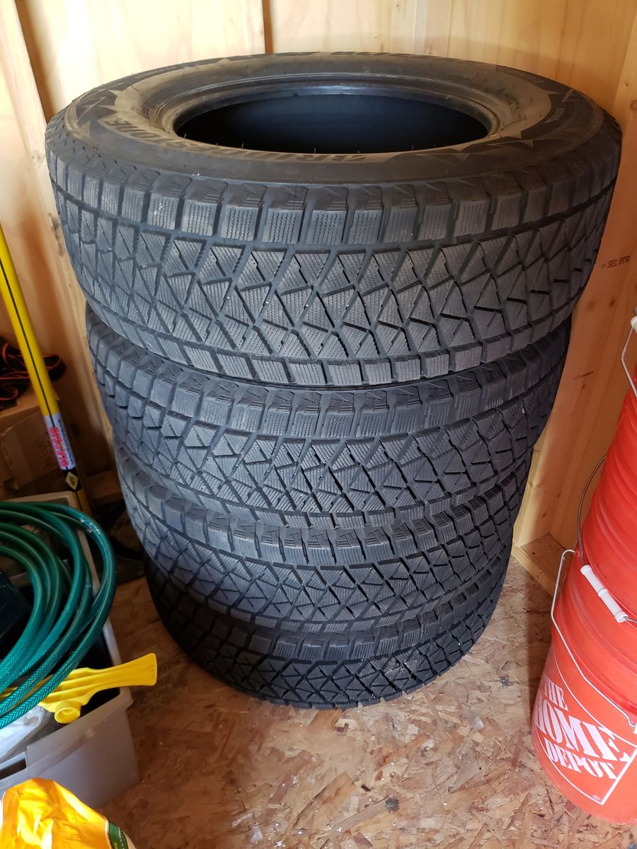 Bridgestone Four 245/17OR17 110S Tires Excellent Condition less than 200 miles.