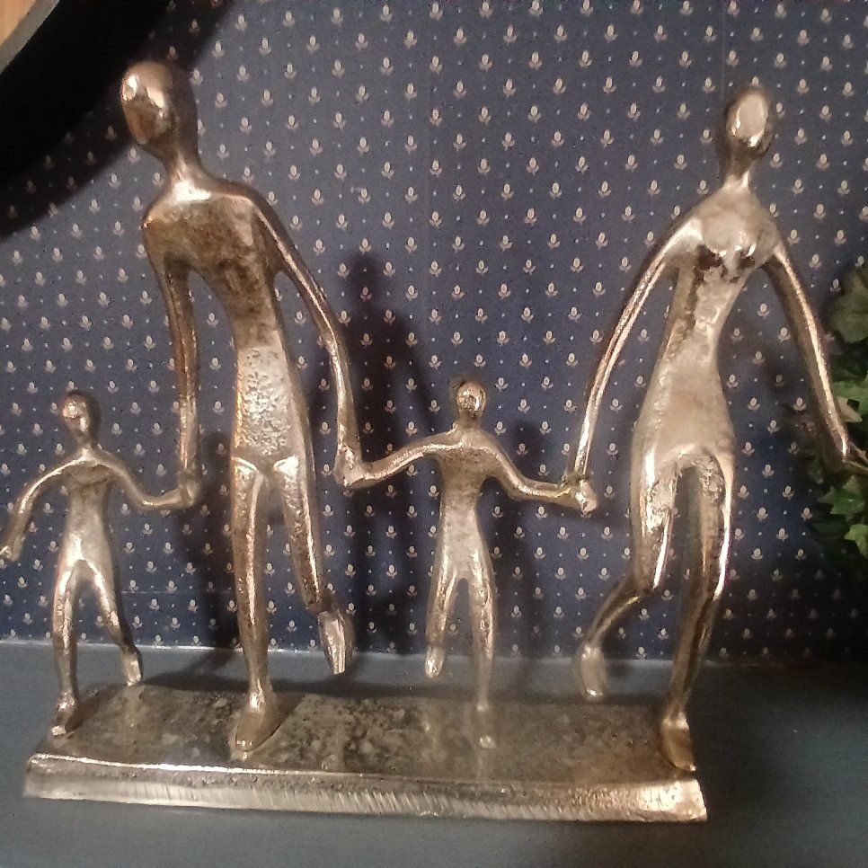 This aluminum family of four tabletop sculpture, hand-finished