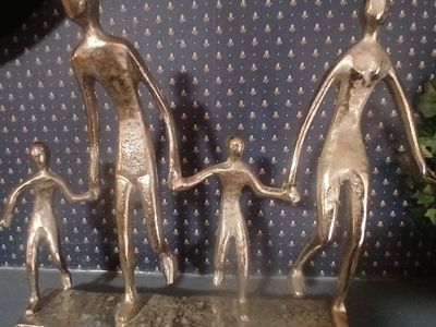 This aluminum family of four tabletop sculpture, hand-finished