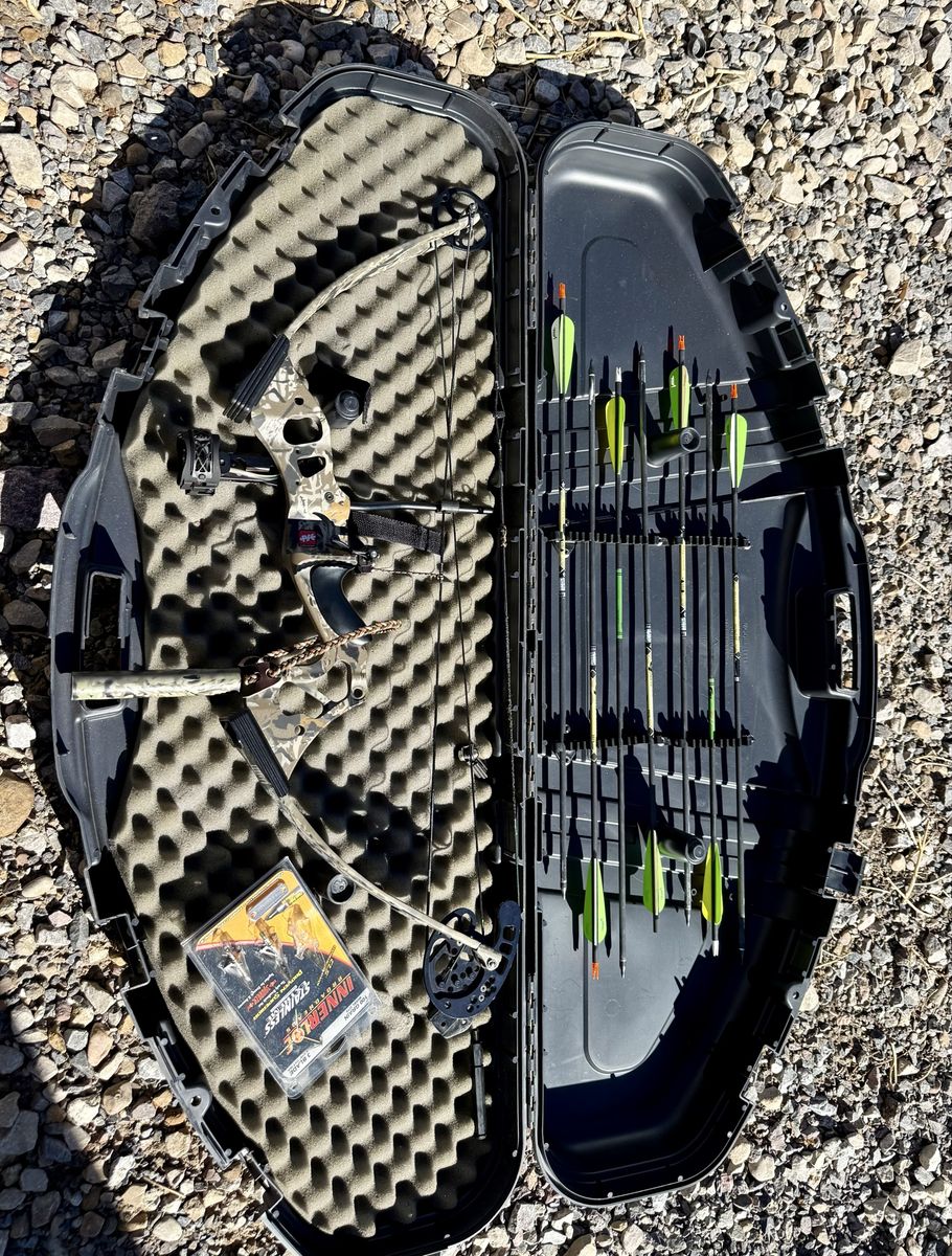 PSE Stingray 29” 70# bow w/sight, arrows, broadheads, and case