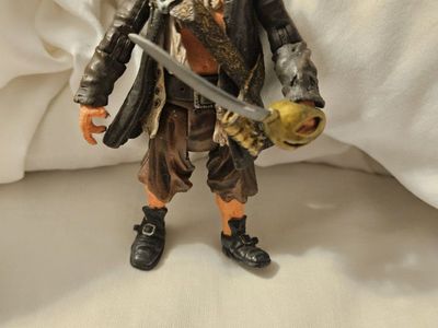 Pirates of the Caribbean Captain Barbossa Action Figure with Sword, 7-inch Collectible