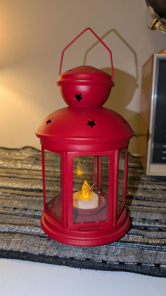 Ikea Rotera red lantern metal and glass tea light holder with battery operated candle