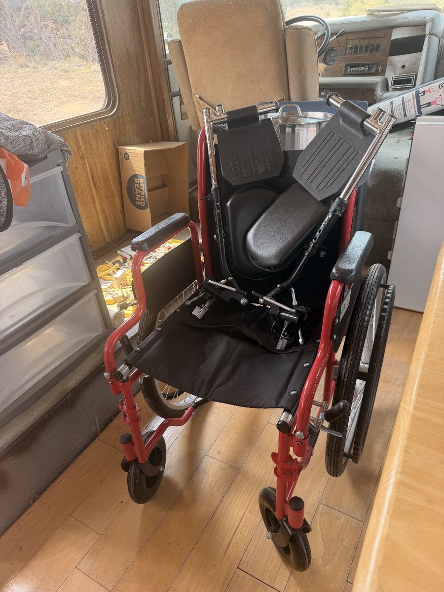 Red Folding Manual Wheelchair with Black Upholstery and Footrests