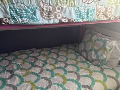 Pink Metal Bunk Bed Frame with Mattresses and Owl/Geometric Bedding Set. Double on bottom bunk and single on top.