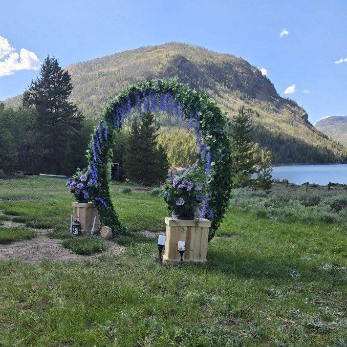 Wedding Archway Decorated with 2 Wooden Plant Stands & Bouquets