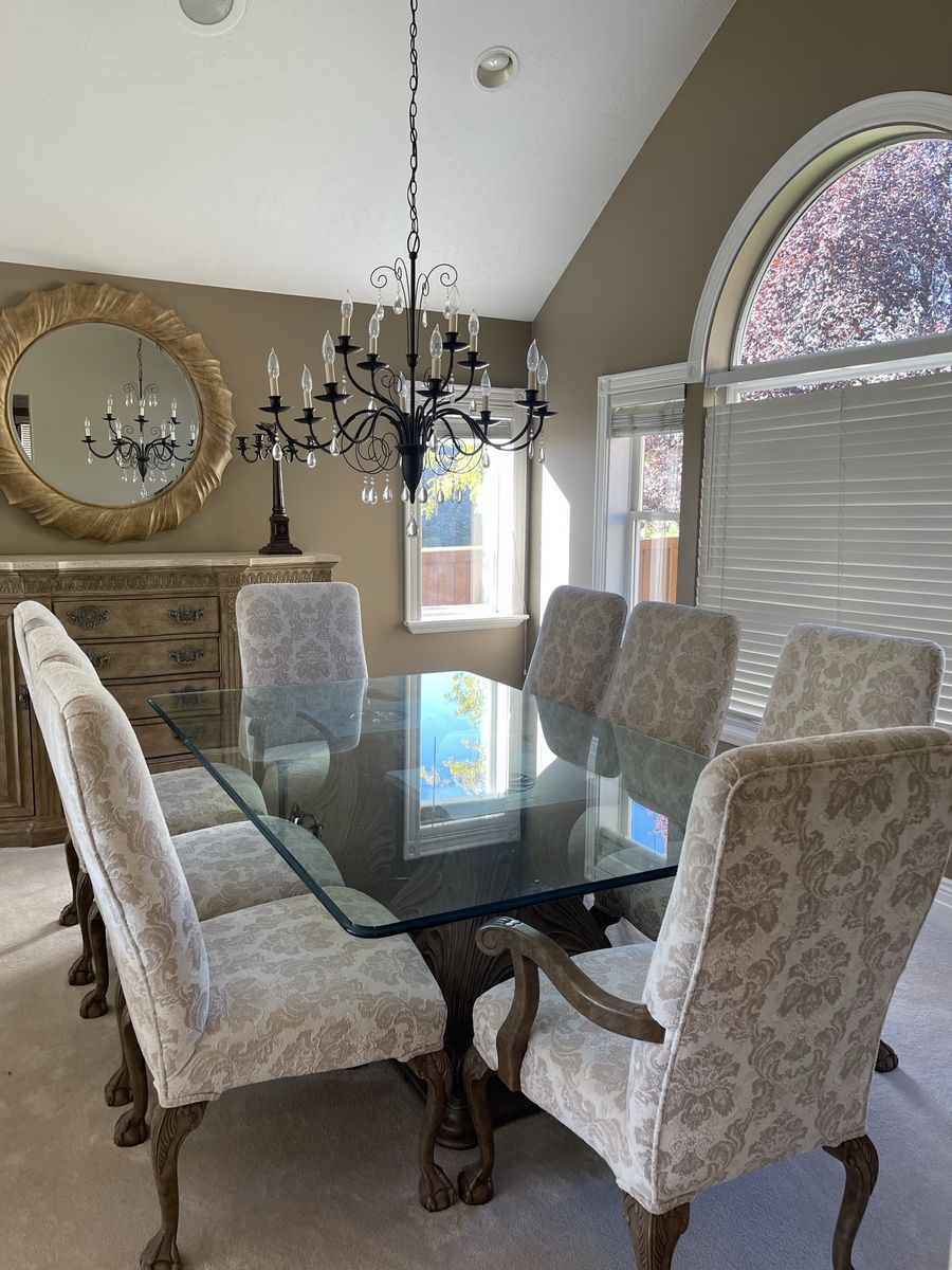 Glass top dining table with 8 chairs
