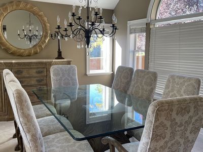 Glass top dining table with 8 chairs