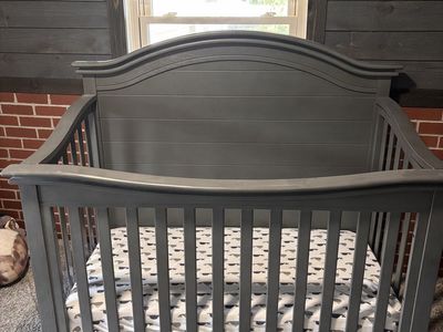 Grey wood baby crib