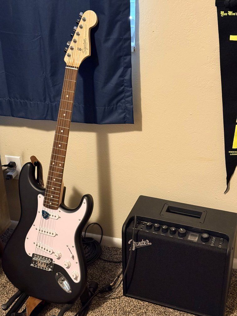 Squire guitar and Fender Mustang LT25  amplifier