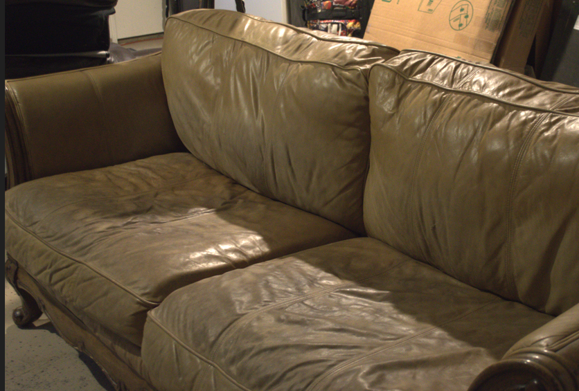 Ashley Ornate Wood Couch and Chair in Beige Leather