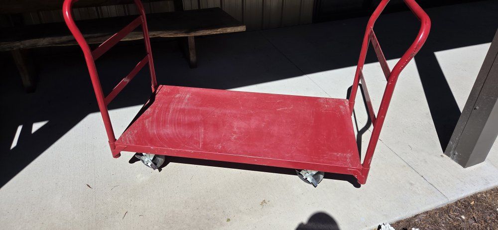 Red Metal Platform Truck with Dual Handles and Locking Casters