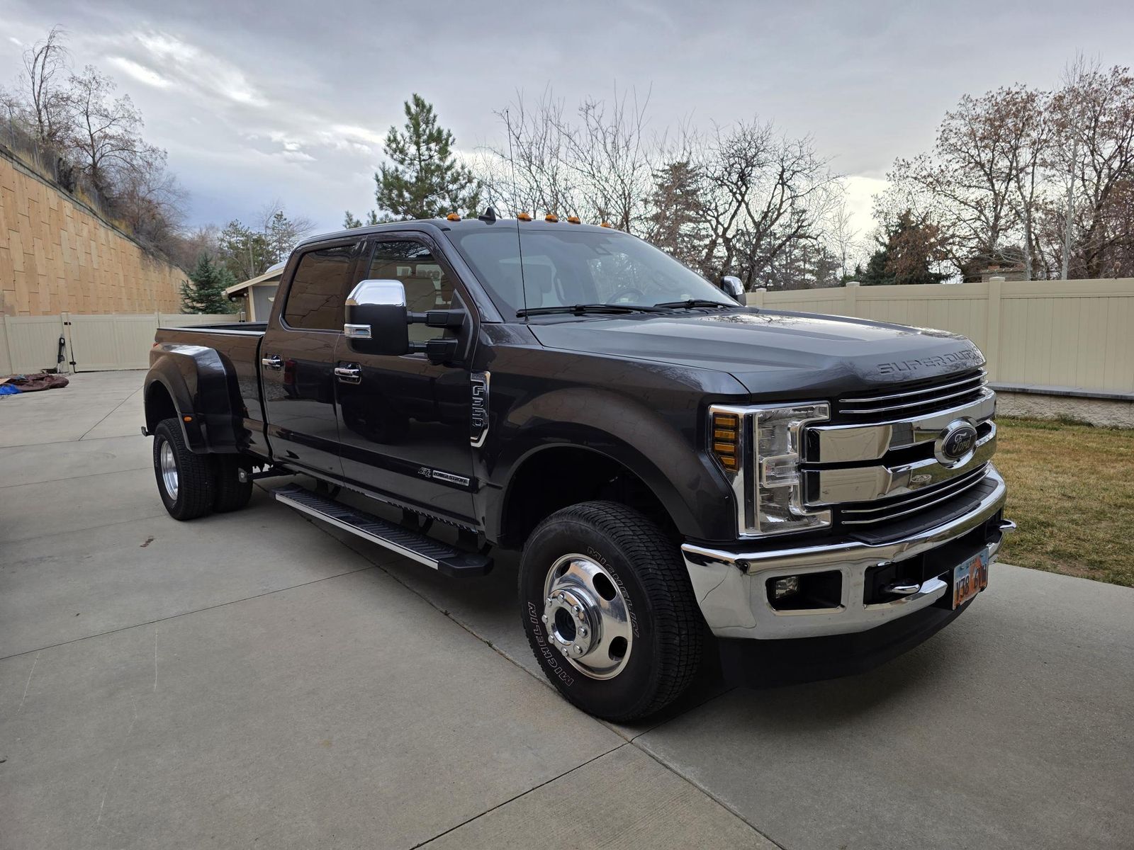 2019 Ford Super Duty F-350 Dually truck with 21,500 miles and a 2019 Lance 975 Camper