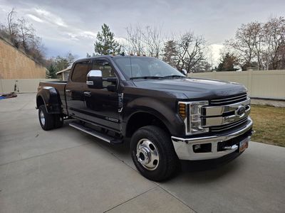 2019 Ford Super Duty F-350 Dually truck with 21,500 miles and a 2019 Lance 975 Camper