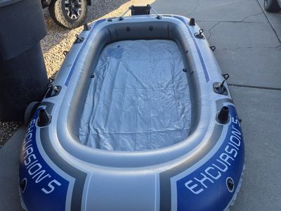 Never used 12 ft inflatable raft w/ new Minn Kota 40 lbs motor.