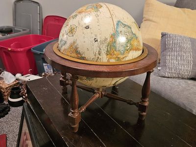 Spinning world globe, wood base