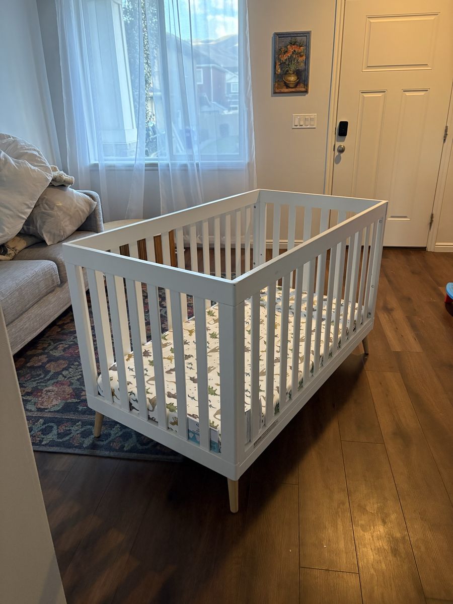 White Baby Crib with Wooden Legs