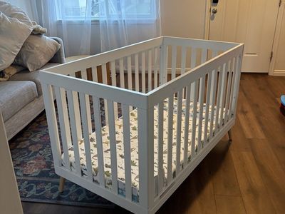 White Baby Crib with Wooden Legs
