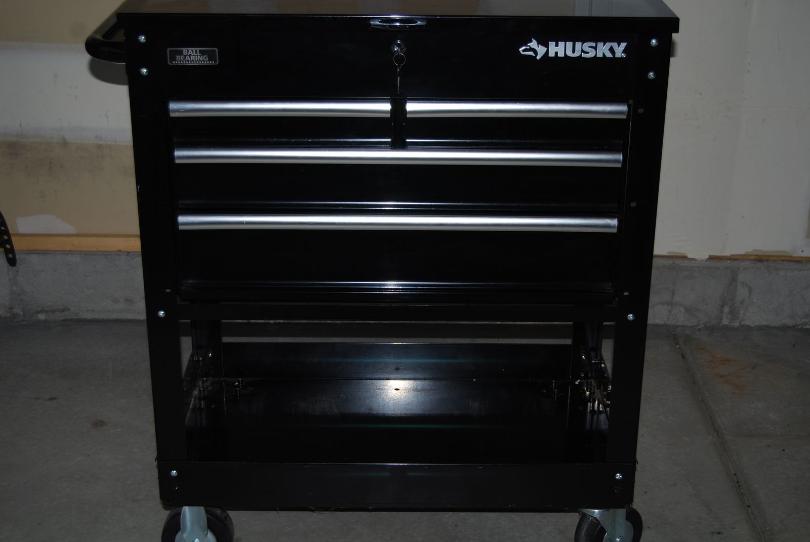 Husky brand 33 inch wide 4-drawer Mechanics tool utility cart in gloss black