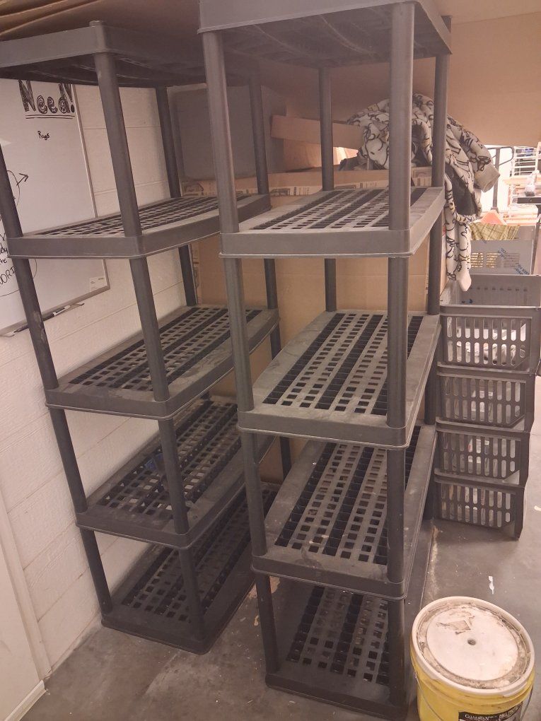 Two 6' tall plastic storage shelves