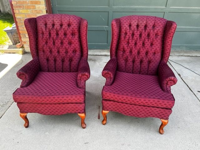 A vintage pair of Queen Anne style wingback chairs