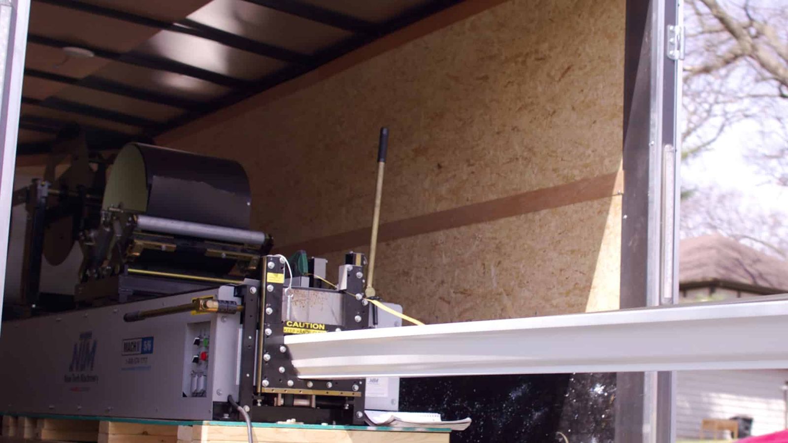 Enclosed Trailer, Siding Brake, and mounted Gutter Bending Machine.