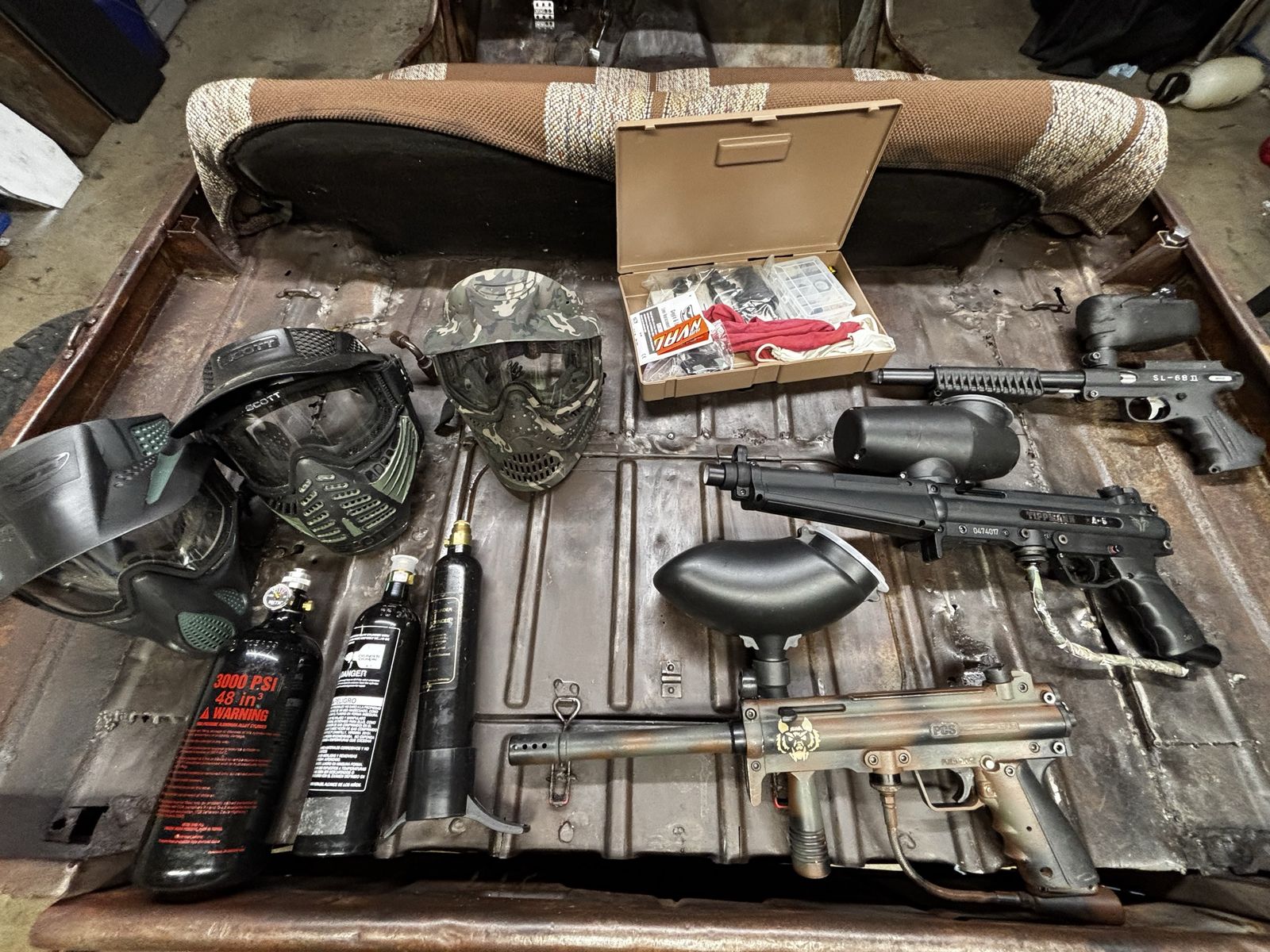 Paintball gear lot: Tippmann A5, Tippmann SL68II, and PCS MP5 with 3 masks