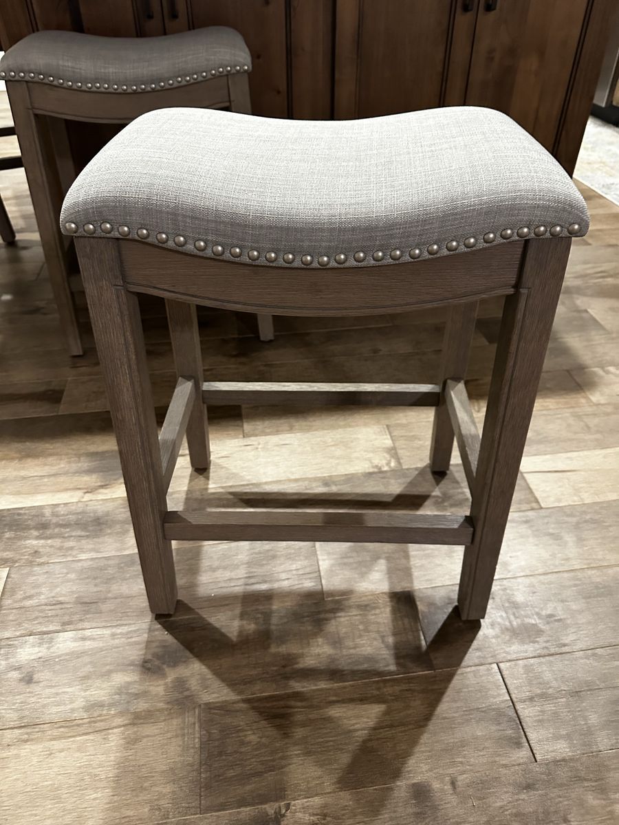 26” Upholstered Saddle Bar Stool with Nailhead Trim and Footrest- Gray Fabric Wooden Frame. Set of 4 