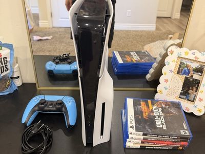 Sony PlayStation 5 Console with Blue Controller and 4 PS5 Games