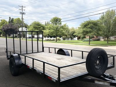 2020 Workhorse 7x14 flatbed trailer extra tie down spots, ramp, and spare tire.