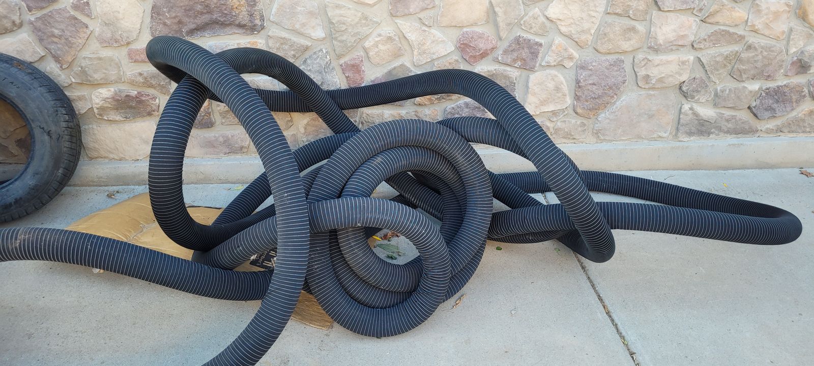 NEW  3-in Corrugated Perforated Pipe with Sock roughly 85 feet long