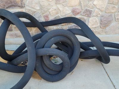 NEW 3-in Corrugated Perforated Pipe with Sock roughly 85 feet long