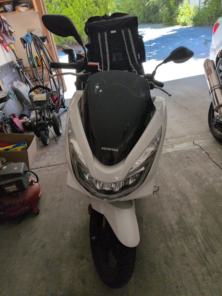 White Honda PCX Scooter - Efficient Commuter
