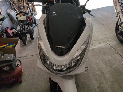 White Honda PCX Scooter - Efficient Commuter