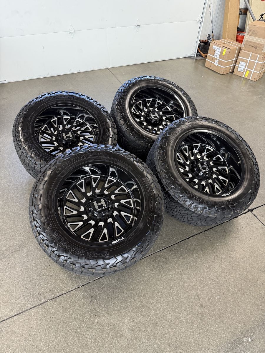 BRAND NEW 22x12 hostile wheels/ 37x13.50r22 nitto recons 8x170