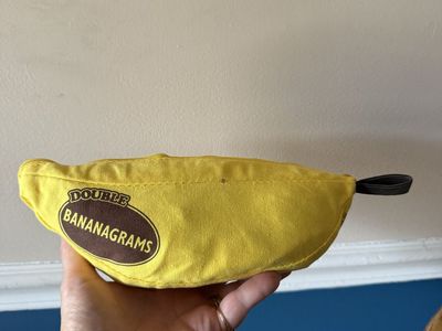 Double Bananagrams Word Game with Yellow Banana Pouch and Tiles