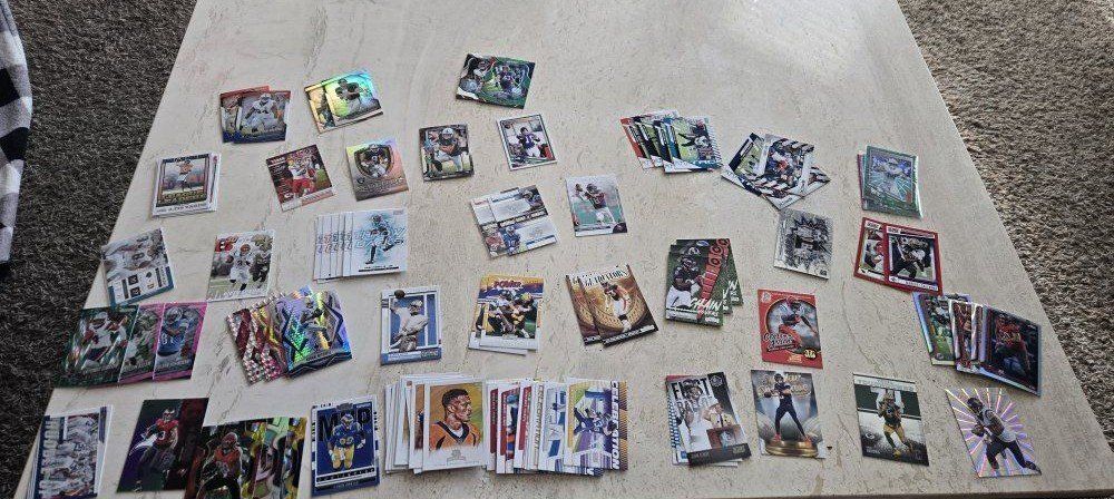 lot of over 700 near mint or mint football cards 100+rc's 100+ inserts 100+ NFL stars prisms parallels