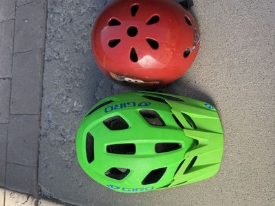 TWO kids bike helmets