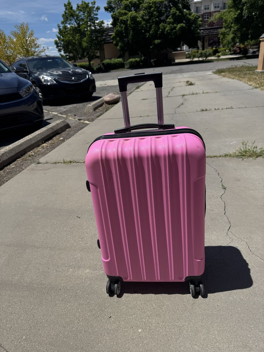 Pink hard sheel luggage 24” Tall