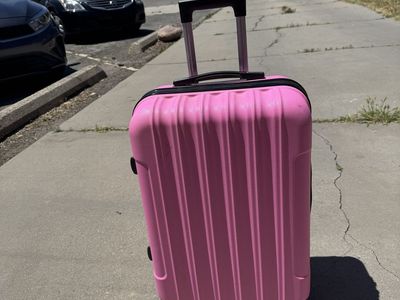 Pink hard sheel luggage 24” Tall