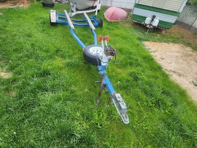 Single axle boat trailer. New axle and new tires and boat buddies