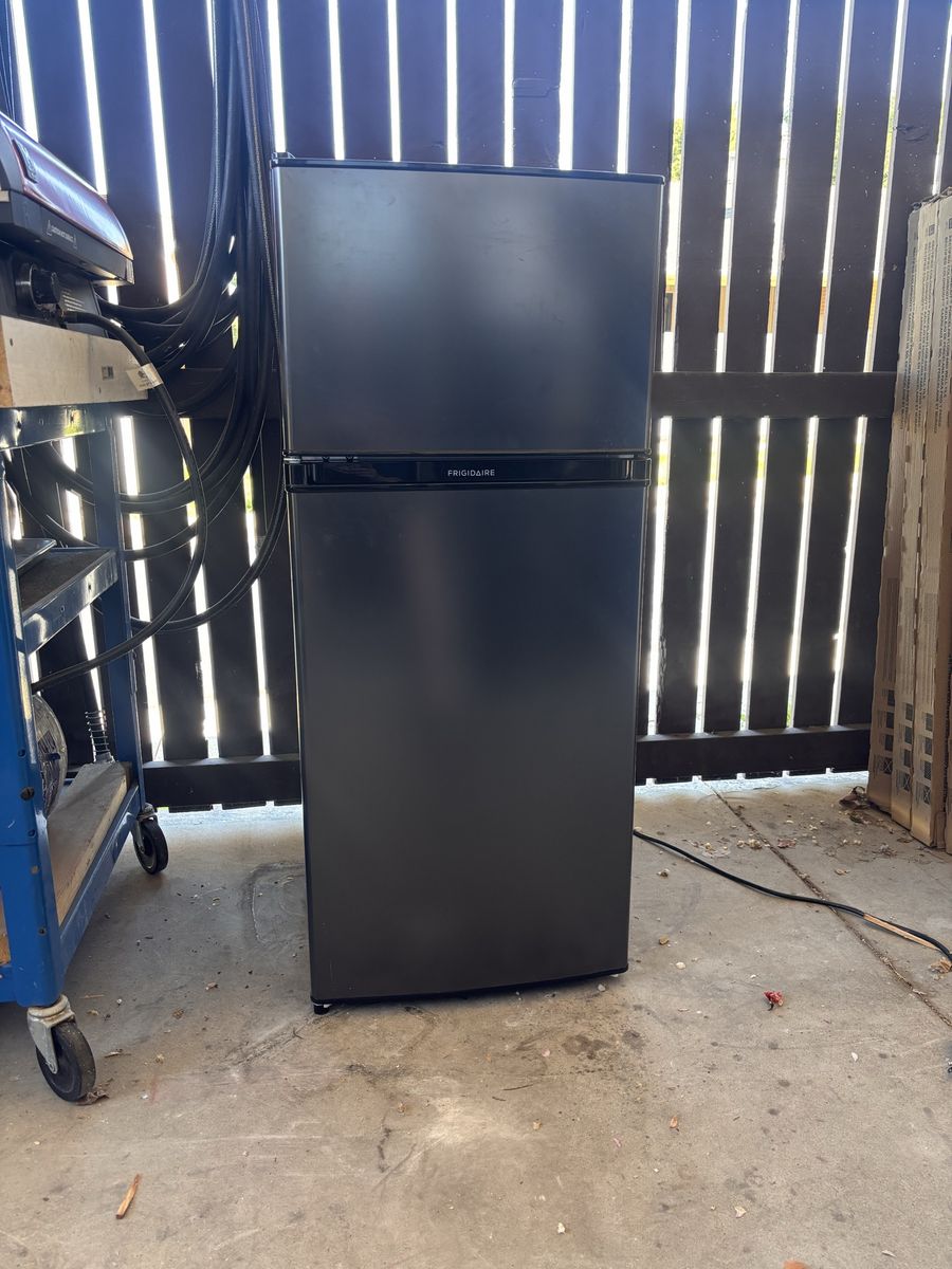 Smaller Frigidaire fridge with freezer.