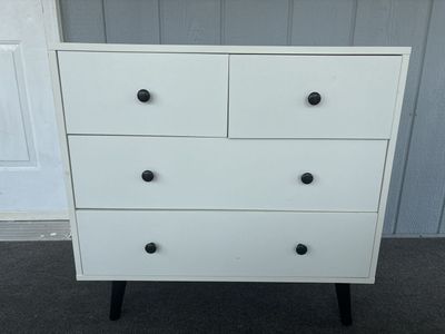Modern White 4-Drawer Dresser Chest with Black Knobs & Tapered Legs