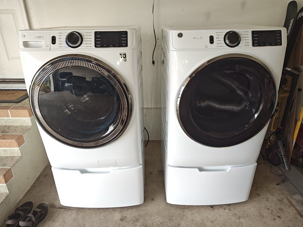 GE Washer and Dry set with Pedestals.  Only used for 6 months.  Electric