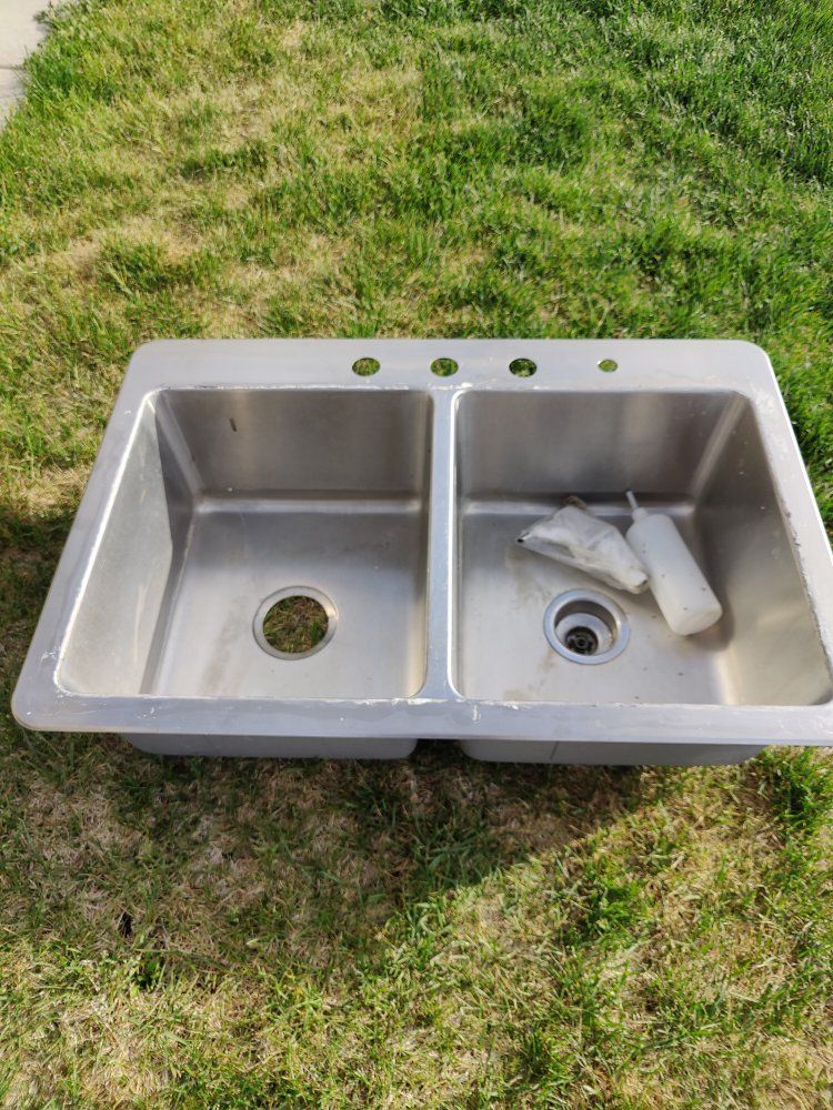 Sink with undermount soap dispenser