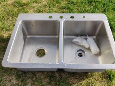 Sink with undermount soap dispenser