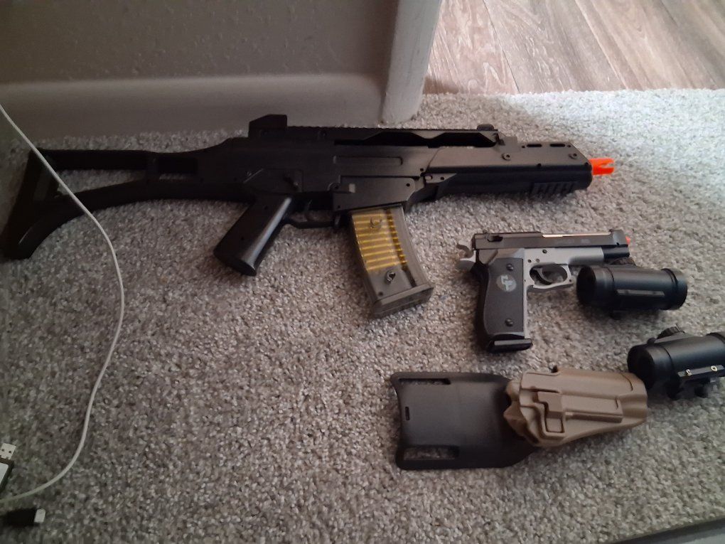 Airsoft spring rifle, 1911 pistol holder and game face pistol