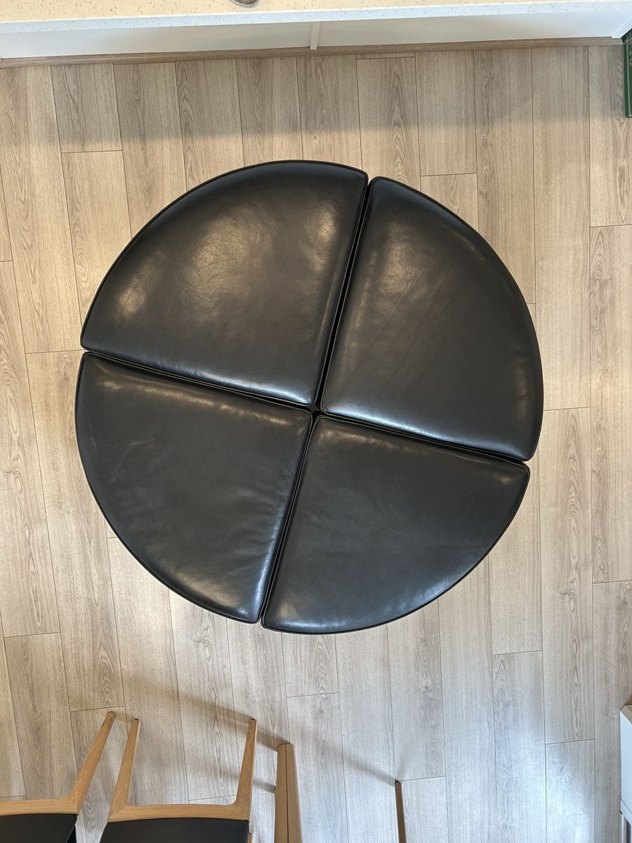 Large Round 4-Piece Modular Leather Ottoman with Nailhead Trim and Wood Legs.